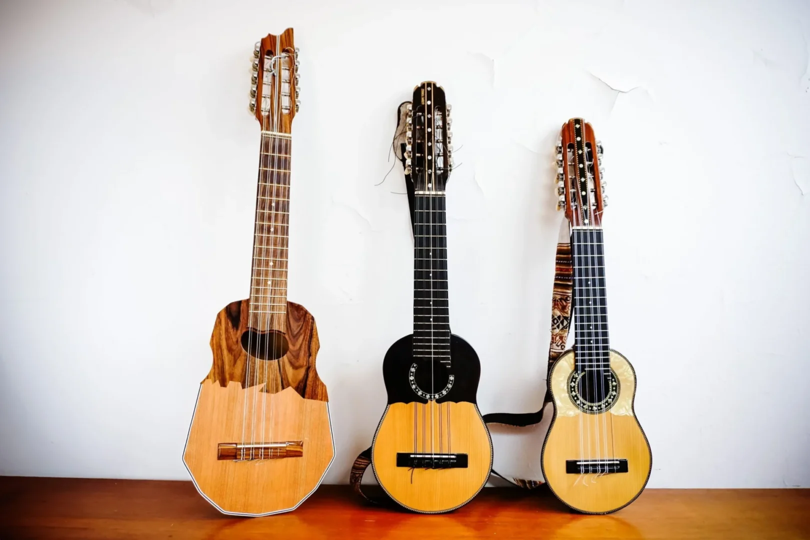 Bolivian ronroco, charangón and charango side by side